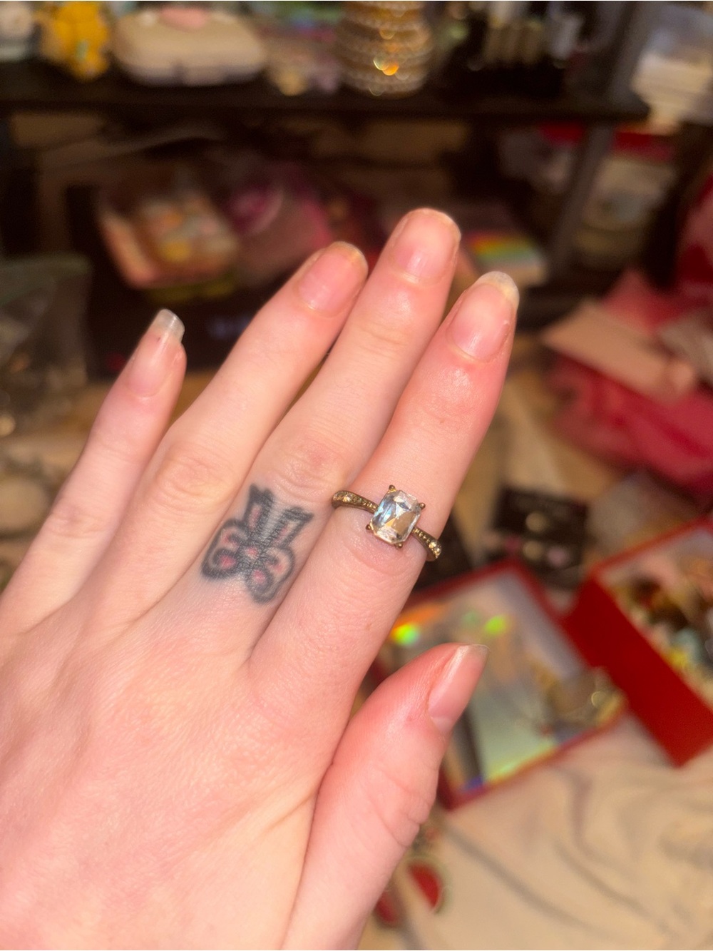 Elegant Gold-Tone Ring with Clear Emerald-Cut Stone